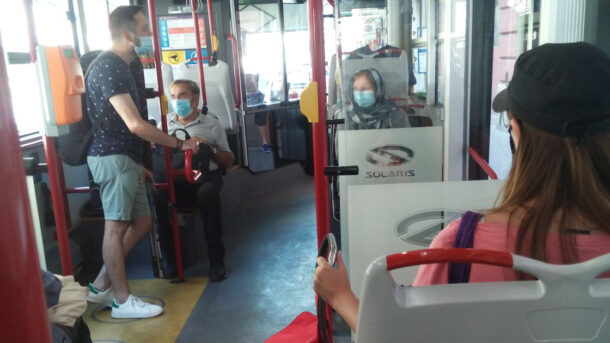 People wearing face masks on Budapest public transport vehicle