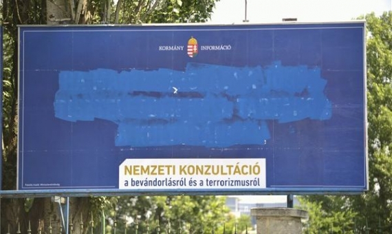 A defaced billboard in Hungary - it was originally installed by the Hungarian government | János Marjai / MTI