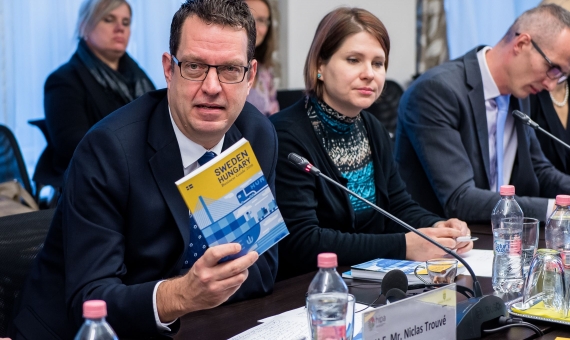 The Swedish Ambassador with the book presented | source: HIPA